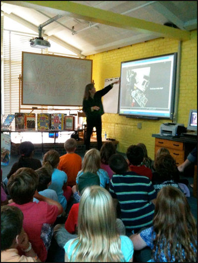 Jean Marzollo in a classroom, using a Smartboard